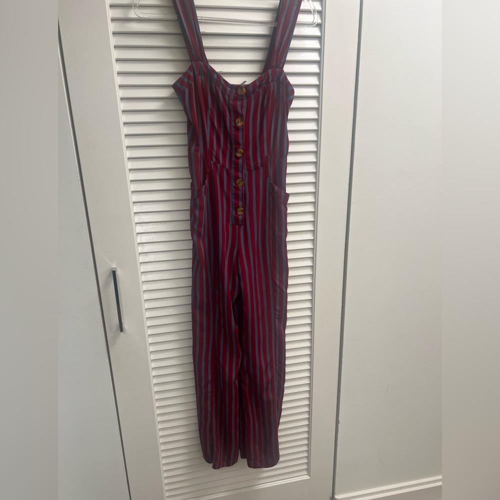 Free people jumpsuit with red and tan stripes.